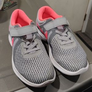 Very light girls Nike sneaker.